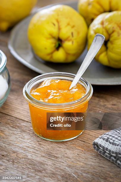 quince, lemon and fresh jam on wooden table - preserves stock pictures, royalty-free photos & images