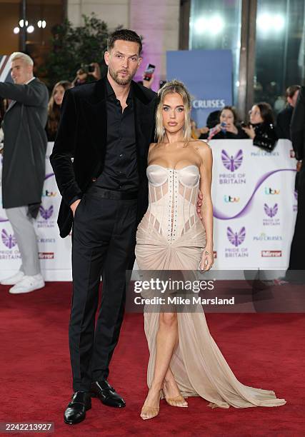 Lewis Burton and Lottie Tomlinson attend the Pride Of Britain Awards 2025 at Grosvenor House on October 20, 2025 in London, England.