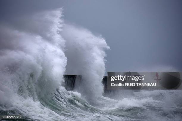 Waves hit the port of Plobannalec-Lesconil, western France, on October 22, 2025 as strong winds hit the coast during the passage of storm Benjamin.