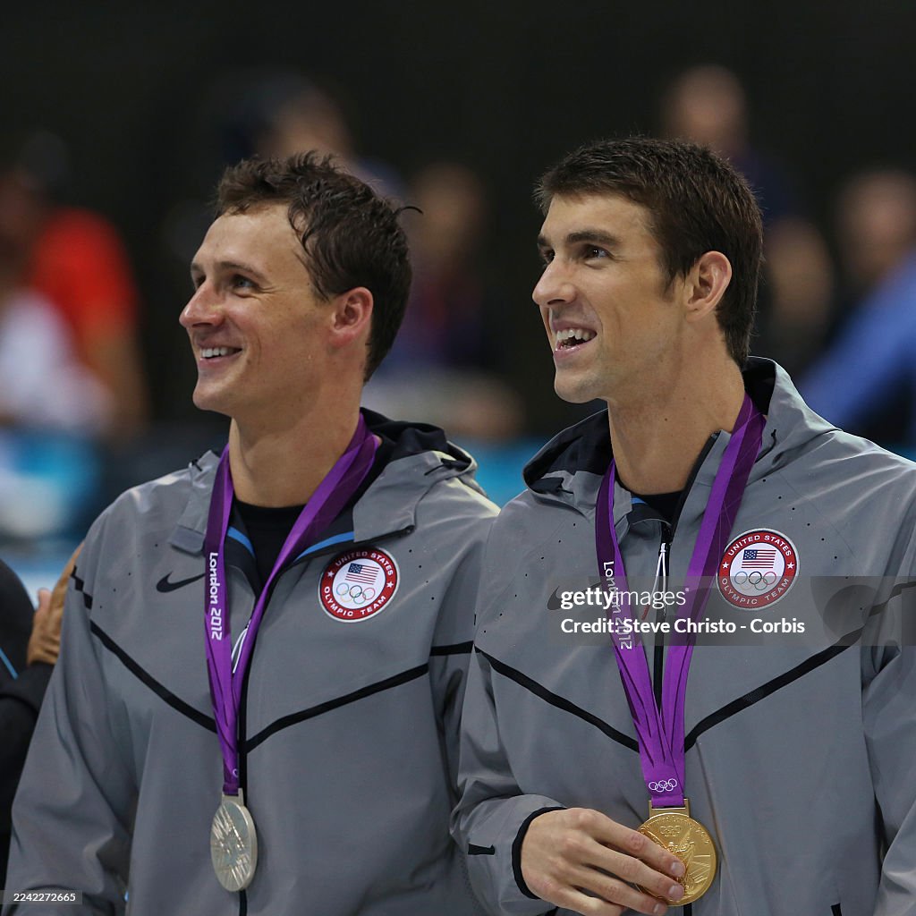 Michael Phelps and Ryan Lochte of the United States walk to