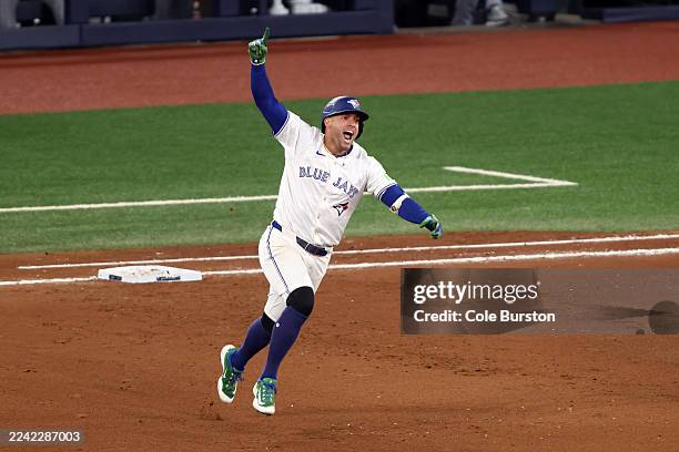 George Springer of the Toronto Blue Jays rounds the bases after hitting a three-run home run during the seventh inning against the Seattle Mariners...