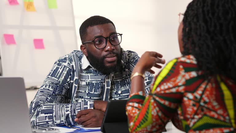 https://media.gettyimages.com/id/2242290523/video/two-african-professionals-engaging-in-a-lively-discussion-at-a-modern-office-exuding.jpg?b=1&s=640x640&k=20&c=JRiVYSCiXaIUPfE0ehQdCwJScLsvdazbsGniLgd0mcs=