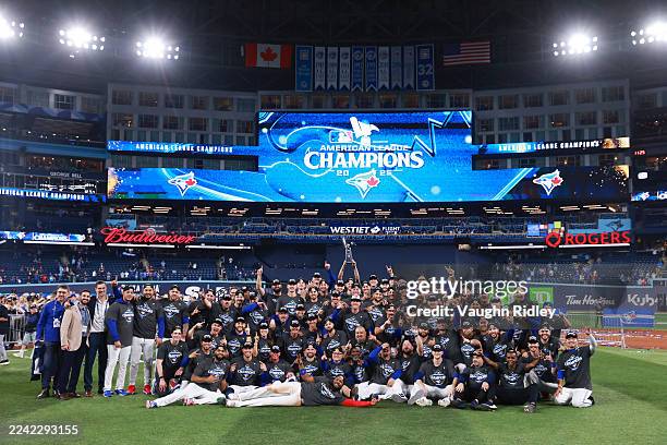 The Toronto Blue Jays pose for a photograph after winning game seven of the American League Championship Series against the Seattle Mariners at the...