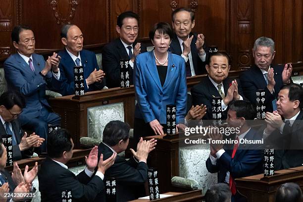 Liberal Democratic Party President Sanae Takaichi is applauded after being elected Japan's new prime minister by lawmakers in the lower house of the...