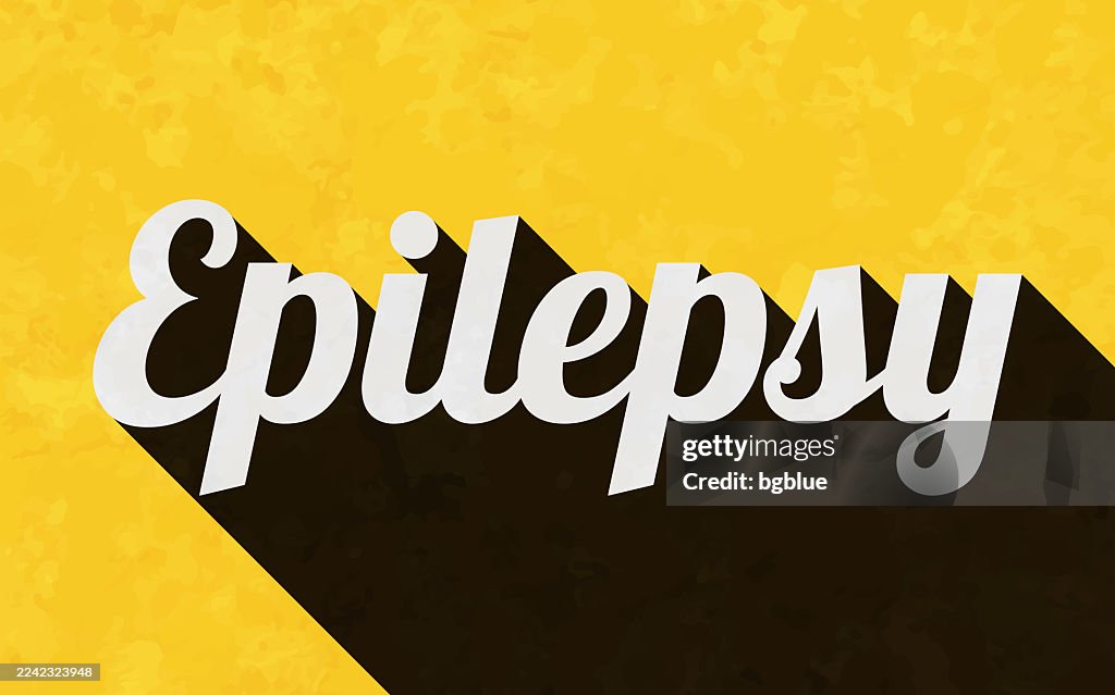 Epilepsy - Text with long shadow on textured yellow background