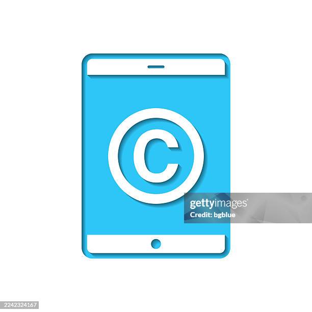 tablet pc with copyright symbol. icon cut out on white paper with blue background - patent application stock illustrations