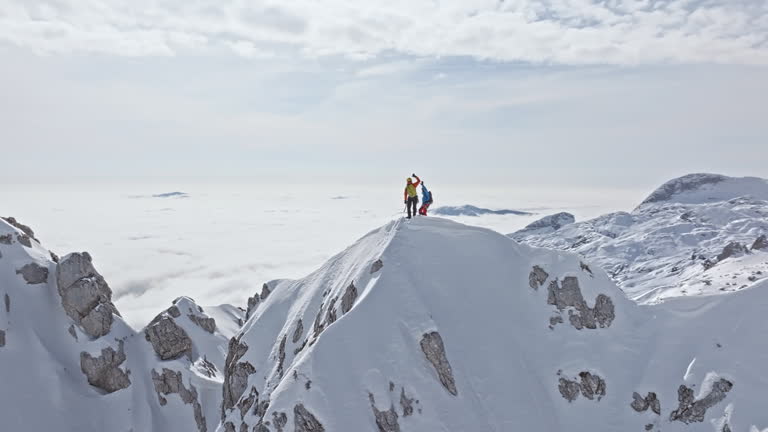 https://media.gettyimages.com/id/2242338185/video/winter-mountaineering-achievement-by-two-climbers-on-icy-peak-ridge.jpg?b=1&s=640x640&k=20&c=A9KMRkPNwxE-hPjPeyIn94k_Q5mpY-7BogDIEPhnAGU=