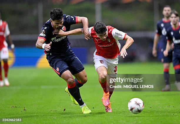 Crvena Zvezda Beograd's Brazilian defender Rodrigao Prado fights for the ball with Sporting Braga's Spanish forward Fran Navarro during the UEFA...