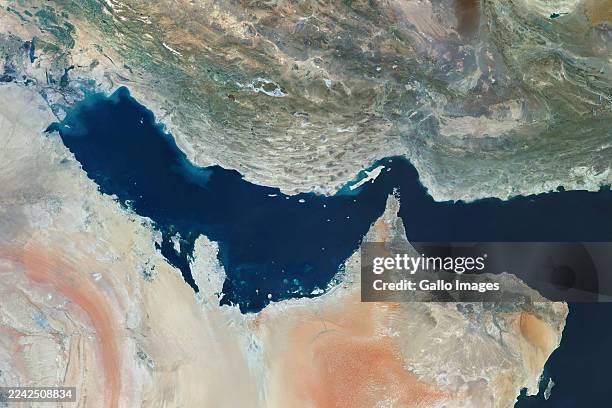 Satellite view of the Persian Gulf, a vital oil and natural gas maritime corridor between Iran and the Arabian Peninsula. The Gulf channels energy...