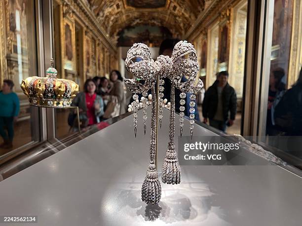 Sets of sumptuous jewelry, including crown, and large bodice bow of Empress Eugénie, are on display at the Louvre Museum on October 21, 2023 in...