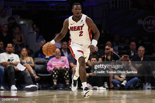 Terry Rozier of the Miami Heat dribbles the ball during the second half in a preseason game against the Memphis Grizzlies at Kaseya Center on October...