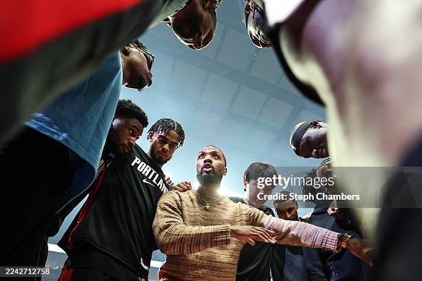 Damian Lillard of the Portland Trail Blazers gathers his teammates before the game against the Minnesota Timberwolves at Moda Center on October 22,...