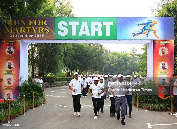 Delhi Police personnel participate in the run for Martyrs in observance of All India Police Commemoration Day to pay homage to the Police Martyrs...