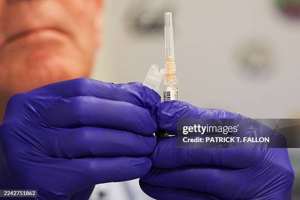 Pharmacist prepares a shot of the Pfizer-BioNTech Covid-19 vaccine during an immunization event at the L.A. Care and Blue Shield of California...