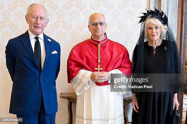Pope Leo XVI poses with King Charles III and Queen Camilla during an audience at the Apostolic Palace on October 23, 2025 in Vatican City, Vatican....