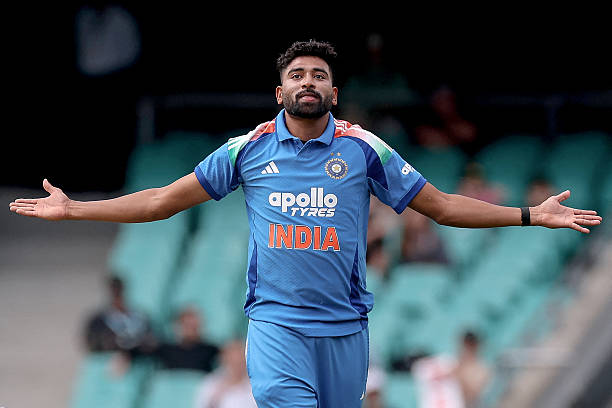 India's Mohammed Siraj celebrates after taking the wicket of Australia's Travis Head during the third one-day international men's cricket match...