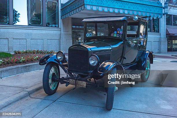 a classic car is parked at west washington ave near wisconsin state capitol in madison, wisconsin, usa - madison wisconsin capitol building stock pictures, royalty-free photos & images