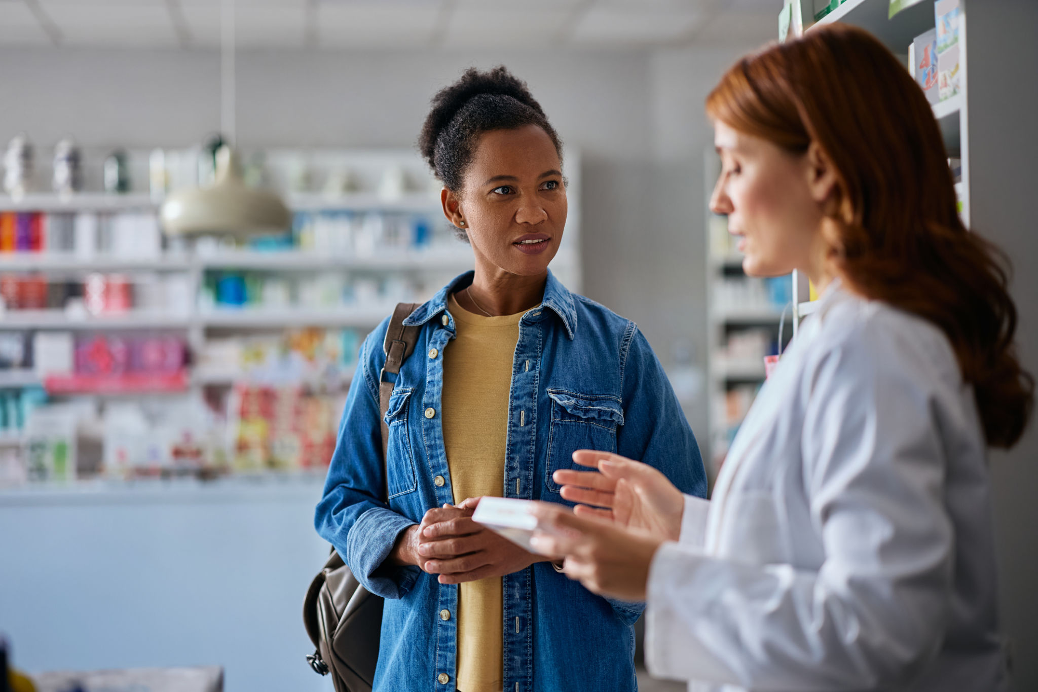 pharmacist consulting patient