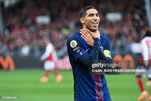 Paris Saint-Germain's Moroccan defender Achraf Hakimi celebrates after scoring his team's second goal during the French L1 football match between...