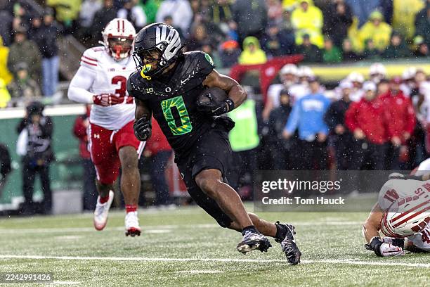 Jordon Davison of the Oregon Ducks runs for a touchdown against the Wisconsin Badgers during the first half at Autzen Stadium on October 25, 2025 in...