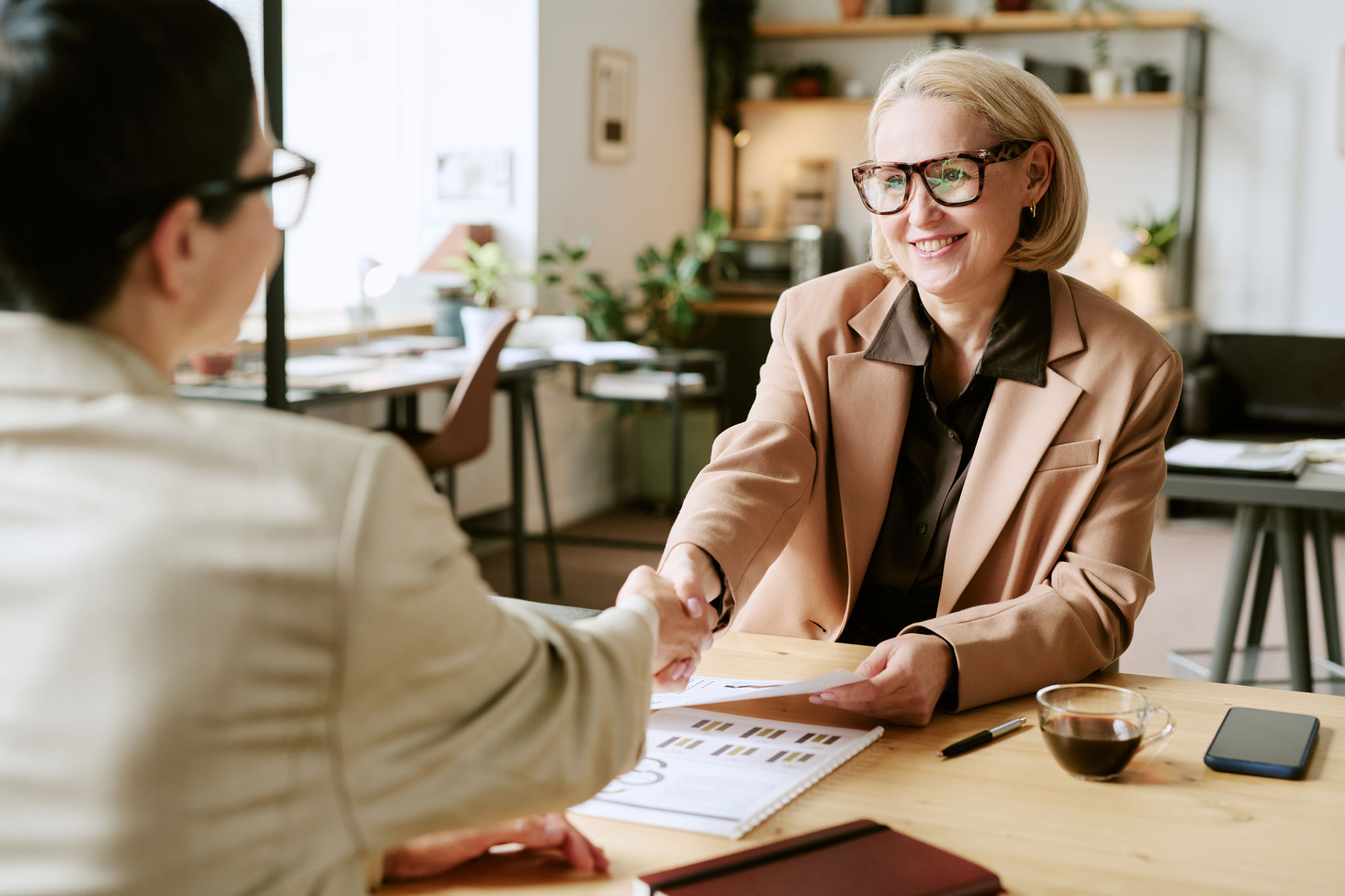 business handshake coffee