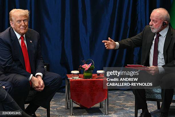 Brazil's President Luiz Inacio Lula da Silva talks to US President Donald Trump during a bilateral meeting on the sidelines of the 47th Association...