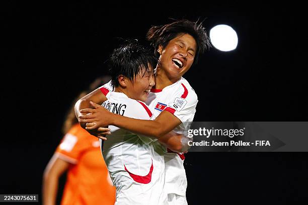 Ui Gyong Ri and Chong Gum Eh of Korea DPR celebrate their side's second goal, an own goal by Maren Groothoff of Netherlands , during the FIFA U-17...