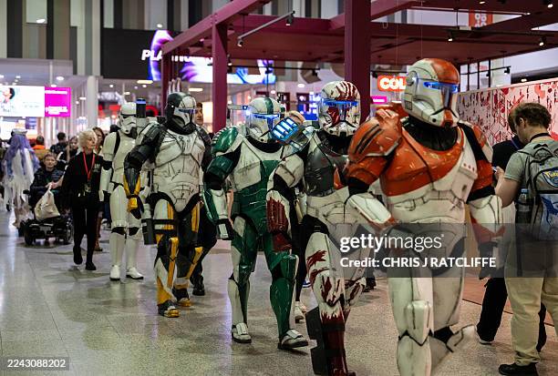 Cosplayers dressed as Clonetroopers and Stormtroopers arrive to attend the MCM Comic Con at ExCeL exhibition centre in London on October 26, 2025.