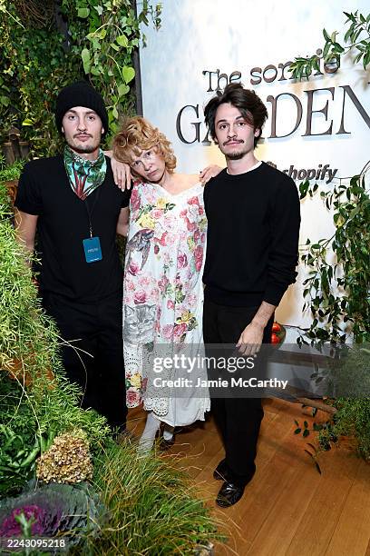 Brandon Thomas Lee, Pamela Anderson, and Dylan Jagger Lee attend Pamela Anderson's "Sonsie Garden" with Shopify on October 24, 2025 in New York City.