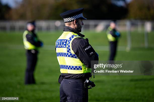 Police officers set up a cordon during an emergency services test response to chemical incident as part of training exercise, on October 23, 2025 in...