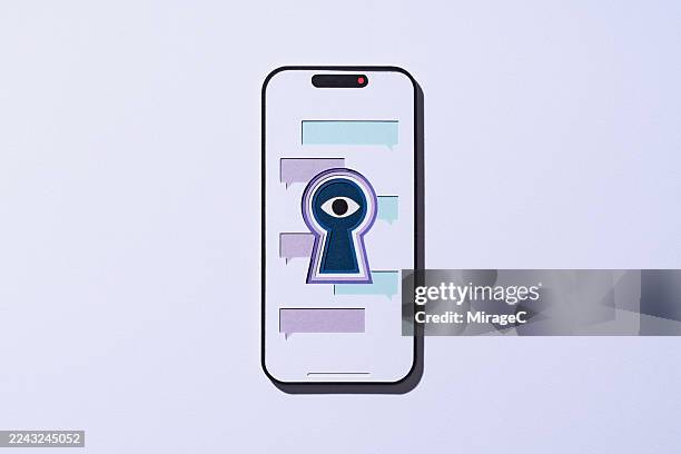 spying eye in keyhole watching data inside a smartphone, paper craft - spyware stock pictures, royalty-free photos & images