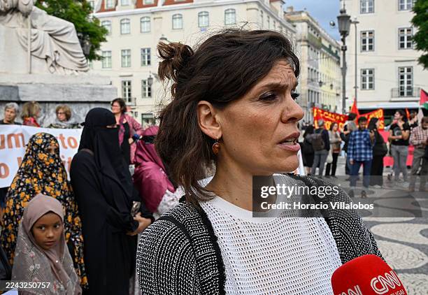 Organizer Raquel Varela talks to journalists in Rossio square during the “Don't Throw Burkas In Our Eyes” demonstration against the niqab and burqa...