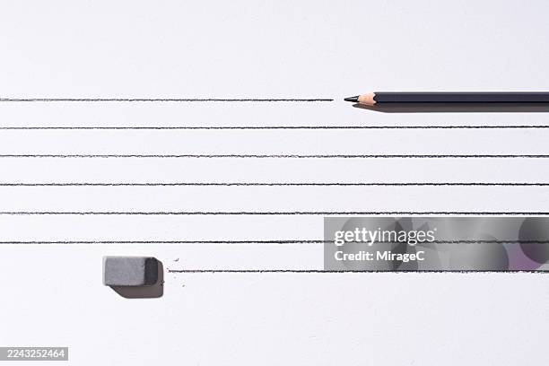 pencil draws parallel lines ahead, eraser follows to remove them - grammar error stock pictures, royalty-free photos & images