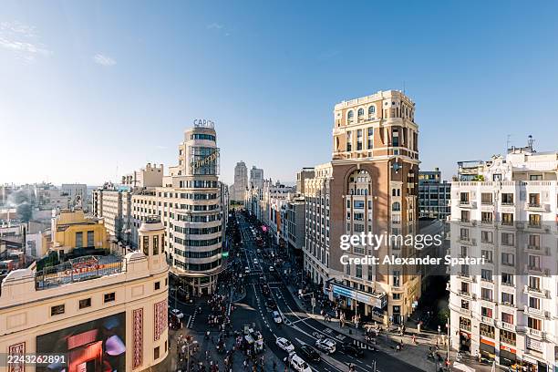 gran via avenue and madrid cityscape on a sunny day with clear blue sky, aerial wide angle view, madrid, spain - madrid stock pictures, royalty-free photos & images