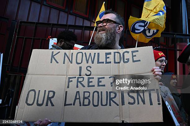 British Library staff, members of the Public and Commercial Services Union , protest in front of the library building after launching a two-week...