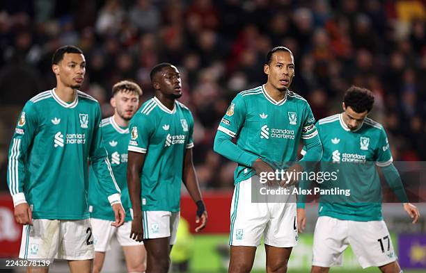 Virgil van Dijk of Liverpool looks on alongside teammates during the Premier League match between Brentford and Liverpool at Gtech Community Stadium...