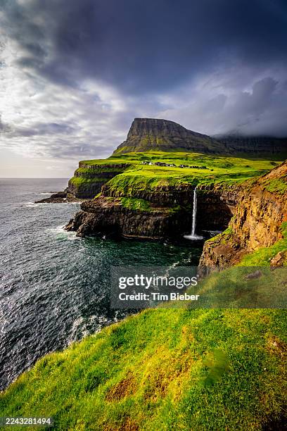 mulafossur waterfall - faroe islands stock pictures, royalty-free photos & images