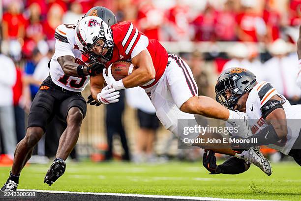 Cameron Dickey of the Texas Tech Red Raiders runs for a touchdown during the first half against the Oklahoma State Cowboys at Jones AT&T Stadium on...