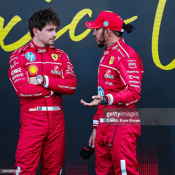 Charles Leclerc of Monaco and Ferrari chats to Lewis Hamilton of Great Britain and Ferrari in Parc ferme during qualifying ahead of the F1 Grand Prix...