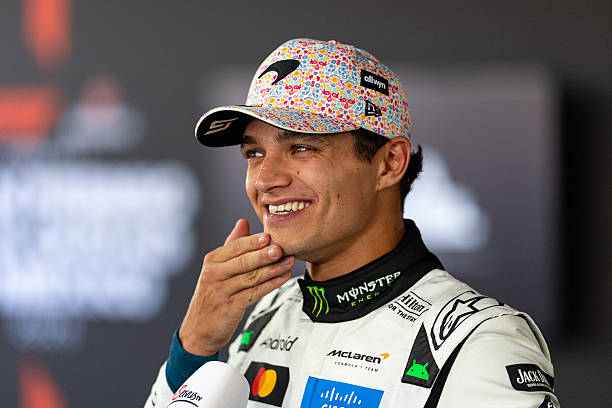 Lando Norris of Great Britain and McLaren smiles in the media pen during qualifying ahead of the F1 Grand Prix of Mexico at Autodromo Hermanos...