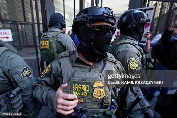 Federal agents arrive at the Dirksen Federal Building to pick up US Customs and Border Patrol Commander Gregory Bovino after his hearing at federal...