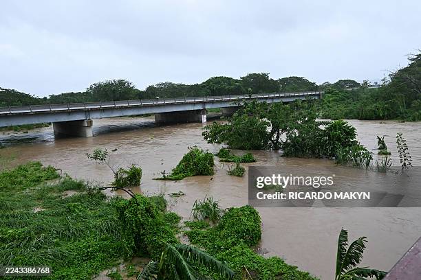 The Rio Cobre comes out of its banks near St. Catherine, Jamaica, shortly before Hurricane Melissa made landfall on October 28, 2025. Ferocious winds...