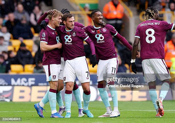 Zian Flemming of Burnley celebrates scoring his team's first goal with teammates during the Premier League match between Wolverhampton Wanderers and...
