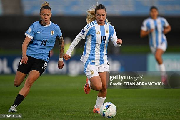 Uruguay's forward Alaides Paz and Argentina's forward Agostina Holzheier fight for the ball during the Conmebol Women's Nations League 2025-26...