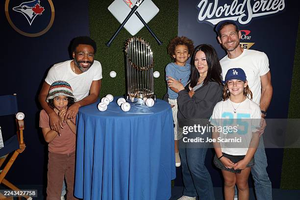 Donald Glover poses for a photo with his family prior to Game Four of the 2025 World Series presented by Capital One between the Toronto Blue Jays...