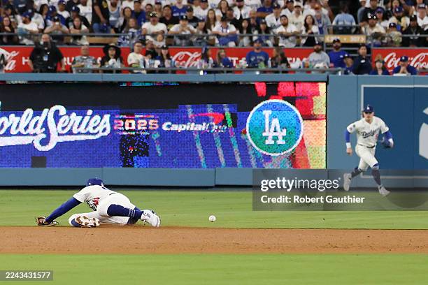 Los Angeles, CA, October 2025: Los Angeles Dodgers shortstop Mookie Betts watches the grounder by Toronto Blue Jays' Addison Barger as left fielder...