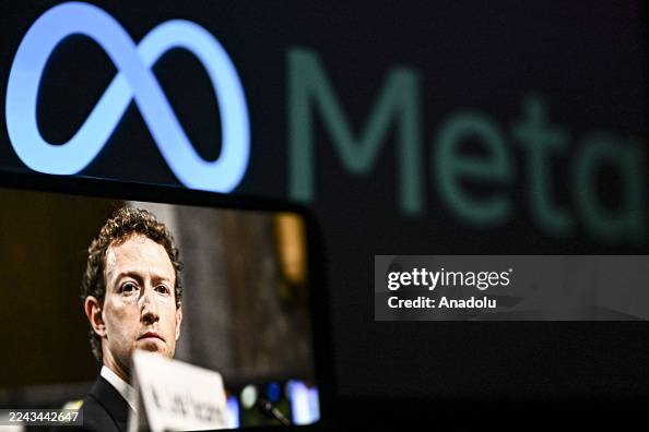 Meta Computer Reddit A computer screen displays Meta logo and a mobile phone screen... News ...