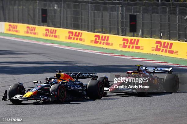 Max Verstappen of the Netherlands driving the Oracle Red Bull Racing RB21 leads Lewis Hamilton of Great Britain driving the Scuderia Ferrari SF-25...