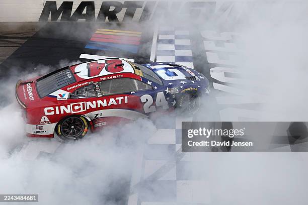 William Byron, driver of the Cincinnati Chevrolet, celebrates with a burnout after winning the NASCAR Cup Series Xfinity 500 at Martinsville Speedway...