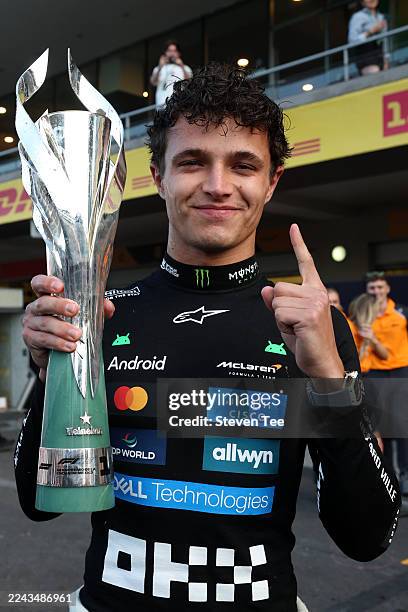 Race winner Lando Norris of Great Britain and McLaren celebrates with his trophy during the F1 Grand Prix of Mexico at Autodromo Hermanos Rodriguez...